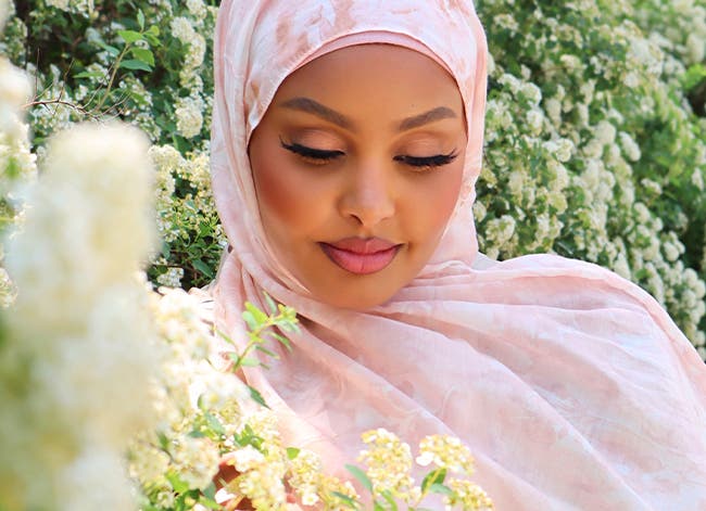 Jasmine Egal wearing a pink floral headscarf.