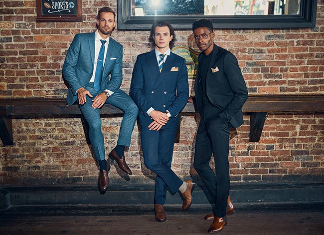 Three men wearing INDOCHINO suits.